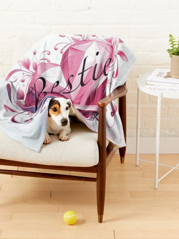 Your furry bestie will love this soft blanket with a pink heart. It’s perfect for snuggling on Galentine’s Day.